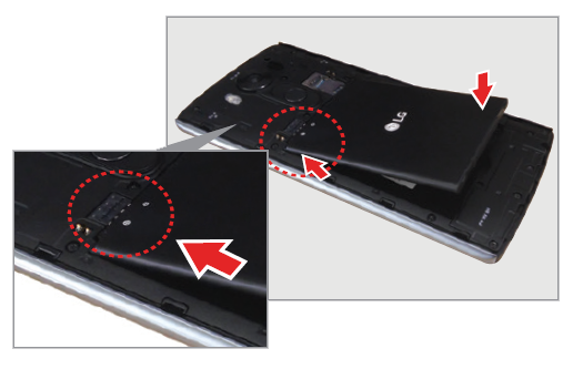 Inserting the battery into the rear of the smartphone